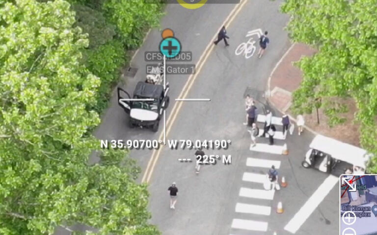 Aerial video overlay with tracker identity and coordinates